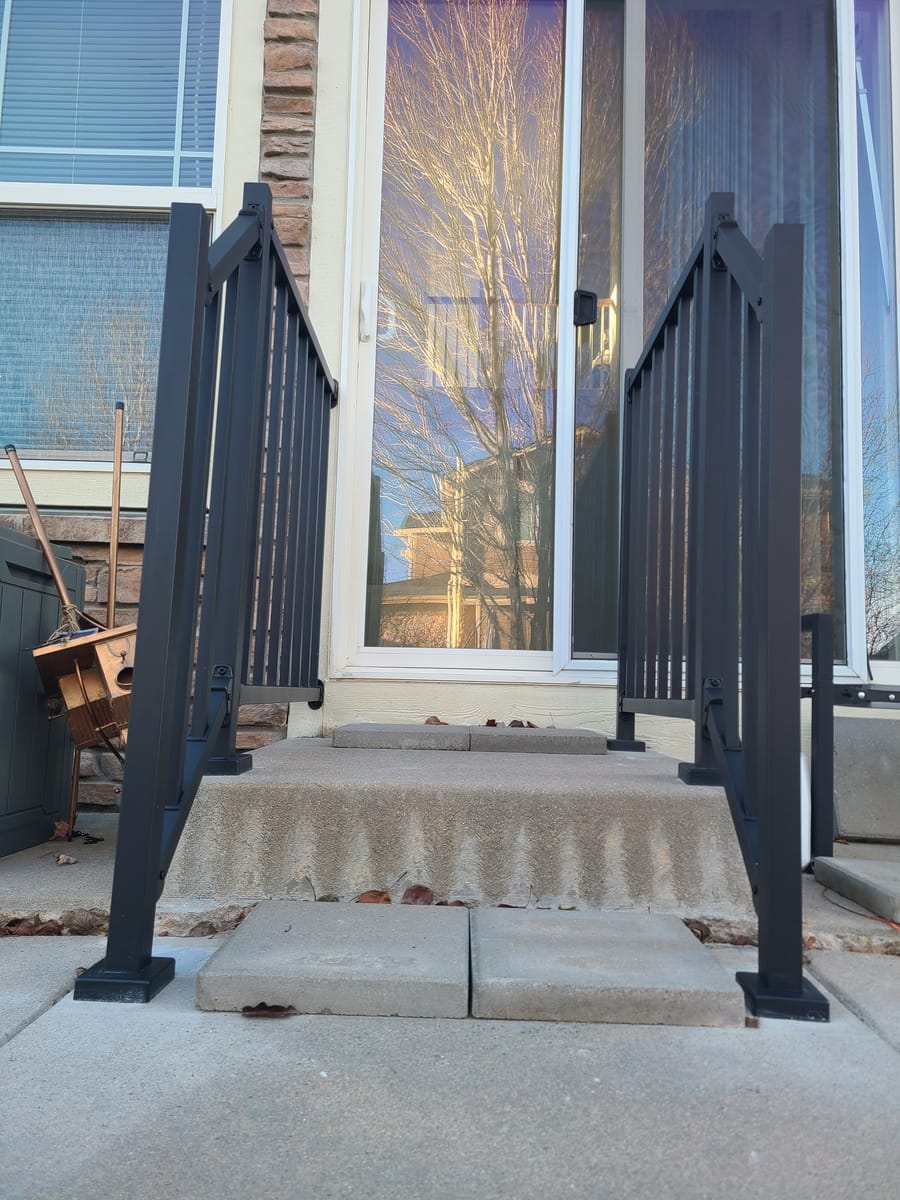 Finished exterior railing on a home's front steps
